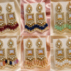 Luxury mirror pearl earrings with crystal detailing and pearl tassels in elegant traditional gold design for women
