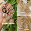 Customized jhumka earrings with gold details, sparkling stones and white pearl accents